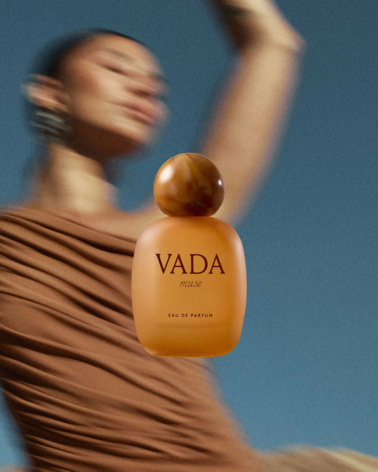 Vada perfume bottle with a dancer in the background