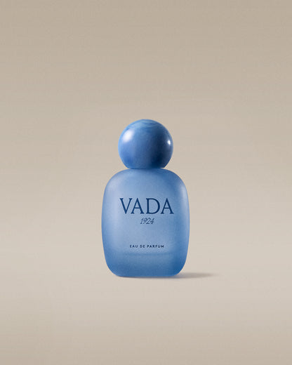 Blue Vada perfume bottle on a beige background