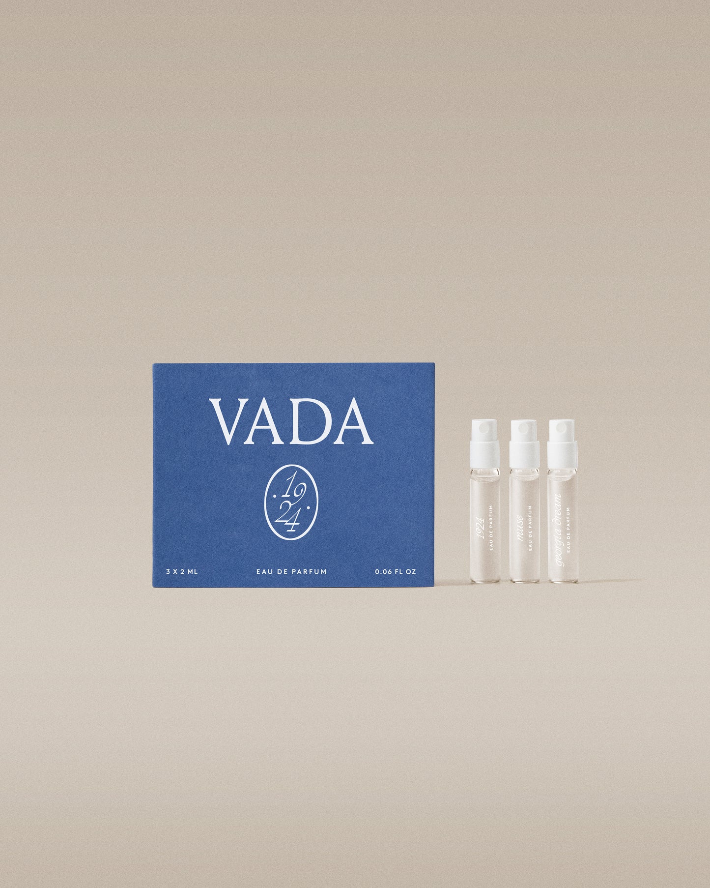VADA perfume packaging with three small bottles on a beige background