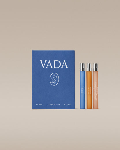 VADA perfume set with a blue box and three small bottles on a beige background