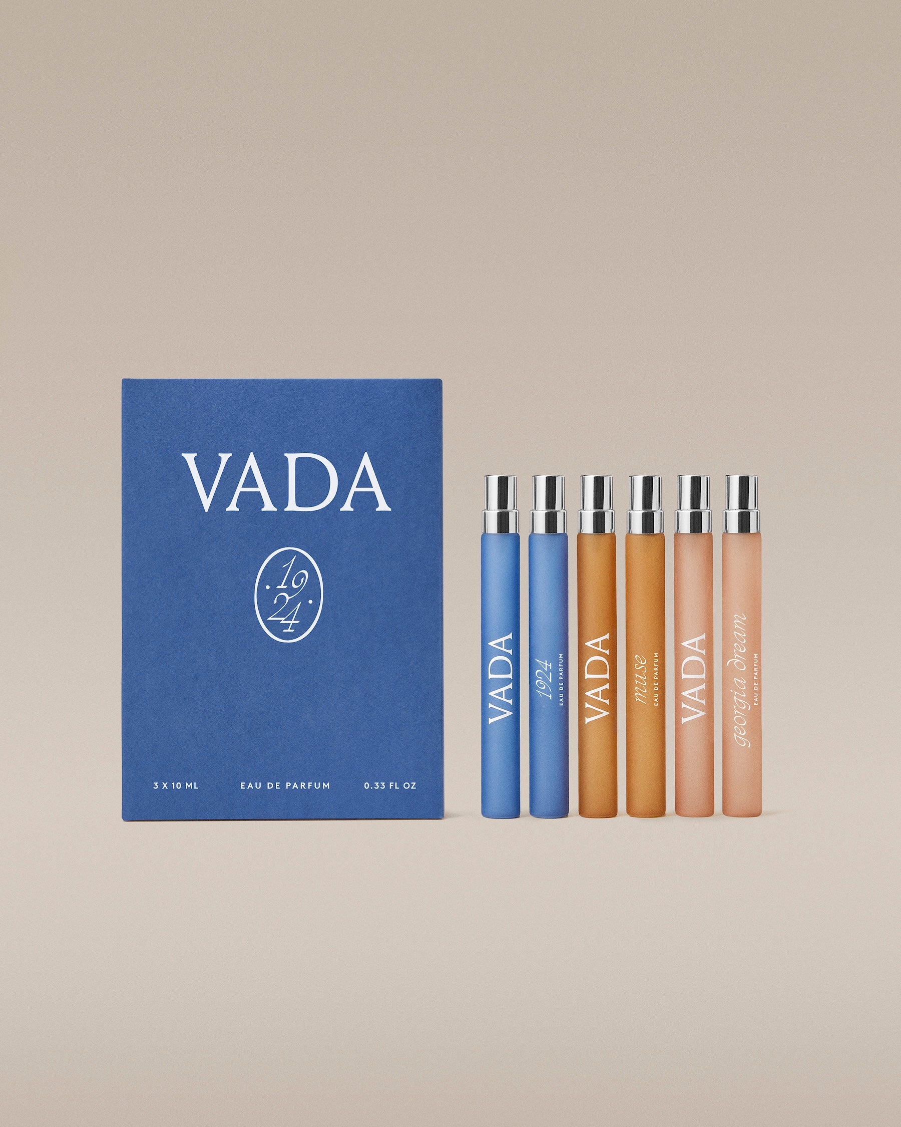 VADA perfume set with a blue box and six bottles on a beige background